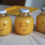 I'm so proud of this!  These jars are actually from apple juice.  I poured out the apple juice and replaced it with orange juice.  Then I drew the Lego man face.  Creative, right?